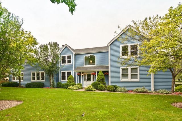 211 Washington Road Lake Forest, IL 60045 - Photo 1 of 26 a front view of a house with a yard