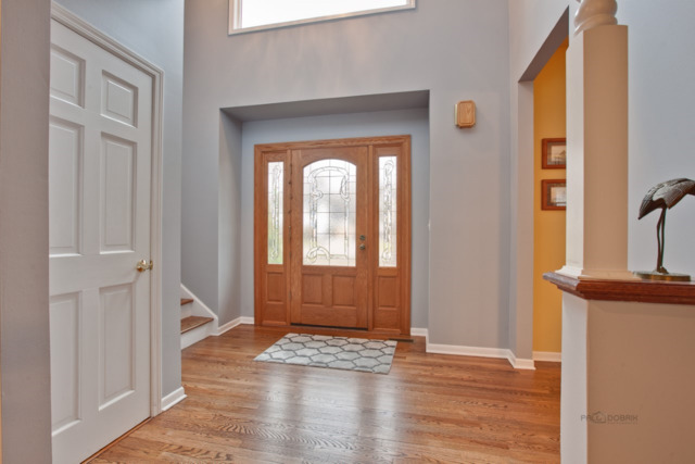 211 Washington Road Lake Forest, IL 60045 - Photo 2 of 26 a view of a hallway with wooden floor and front door