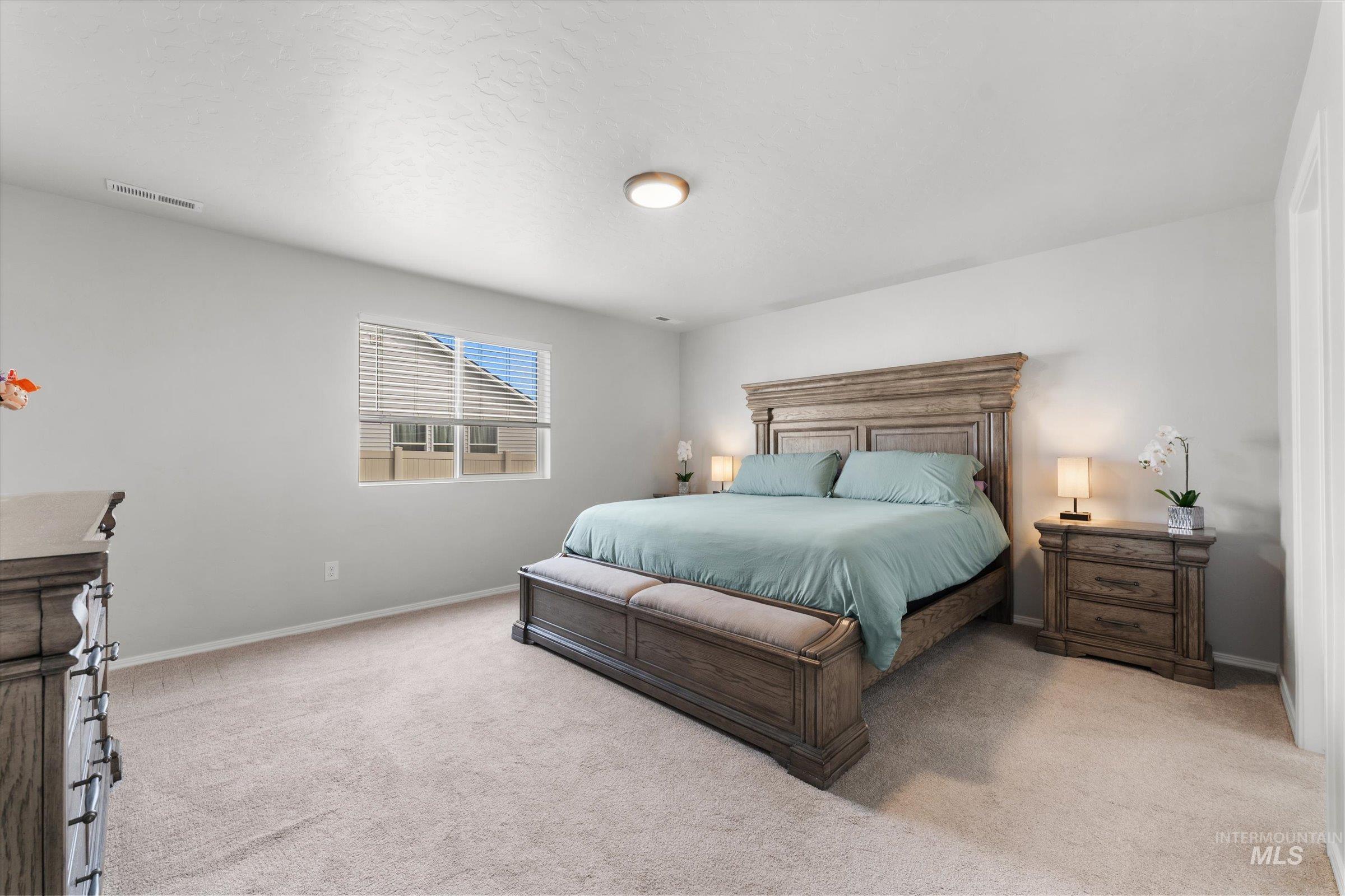 12798 Devonshire Street Caldwell, ID 83607 - Photo 25 of 42 Bedroom with light carpet