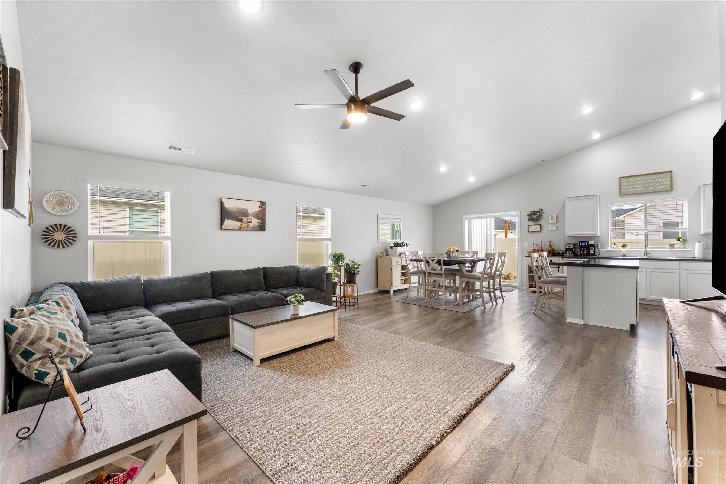 12798 Devonshire Street Caldwell, ID 83607 - Photo 6 of 42 Living room featuring a ceiling fan, recessed lighting, light wood-style floors, and lofted ceiling