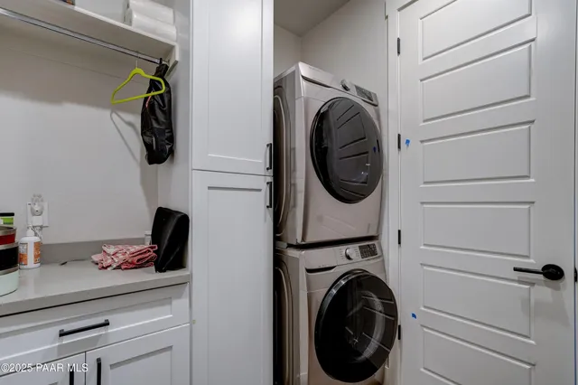 a utility room with sink dryer and washer