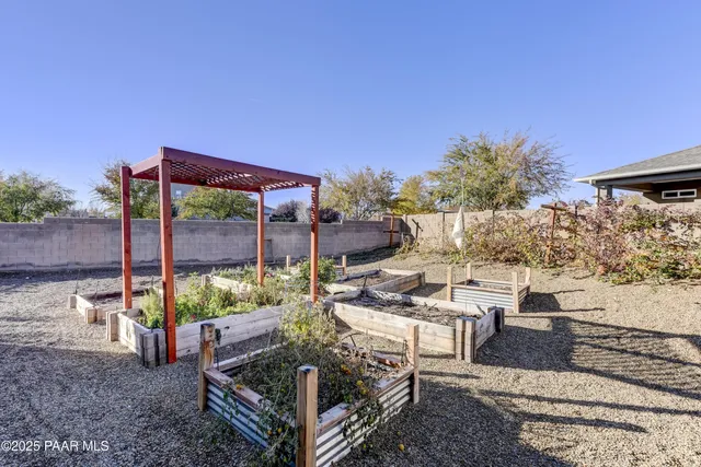 a view of a backyard with sitting area