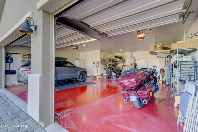 a living room with furniture a rug and a chandelier