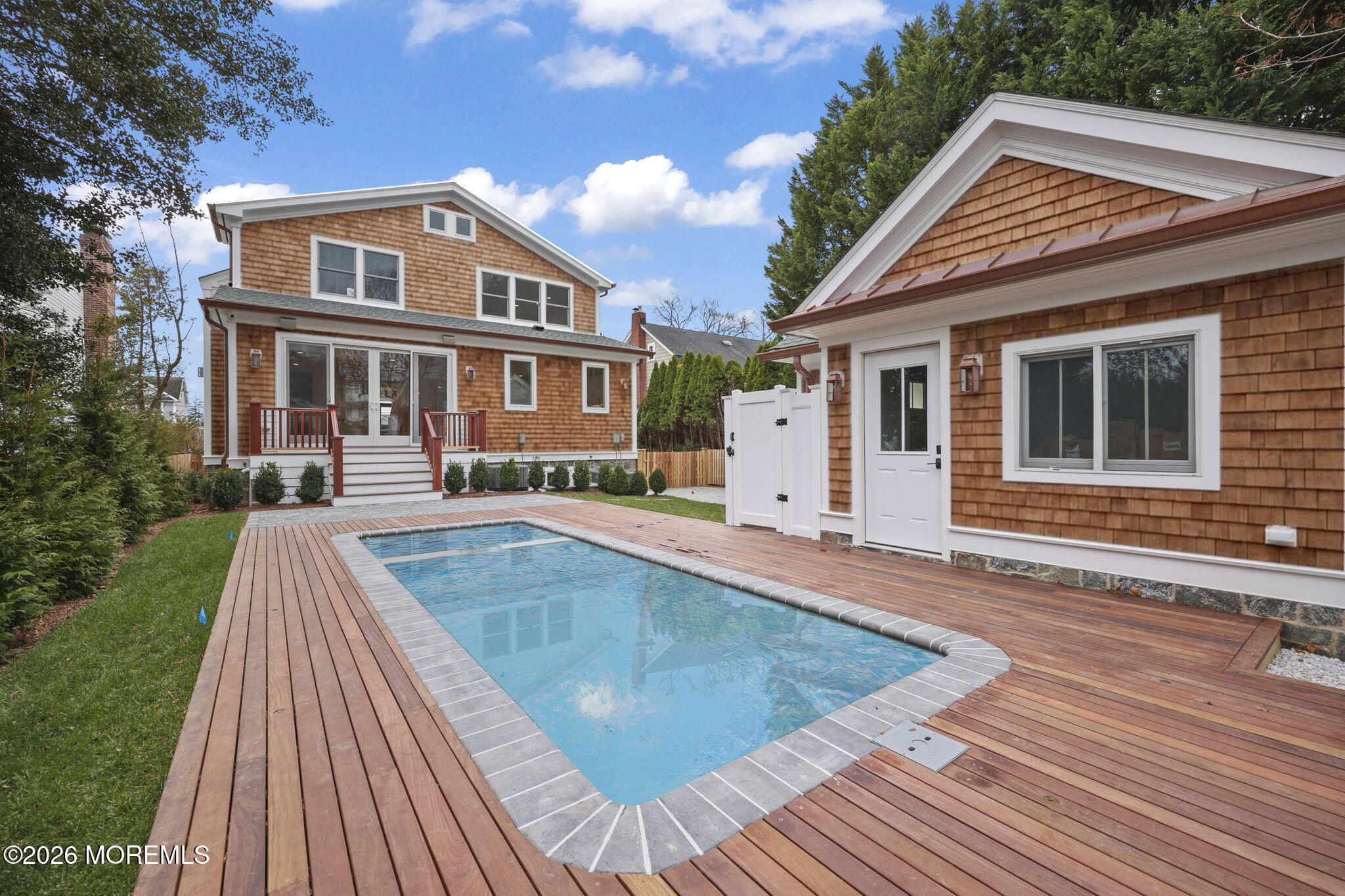 217 Pitney Avenue Spring Lake, NJ 07762 - Photo 15 of 18 a view of a house with a swimming pool