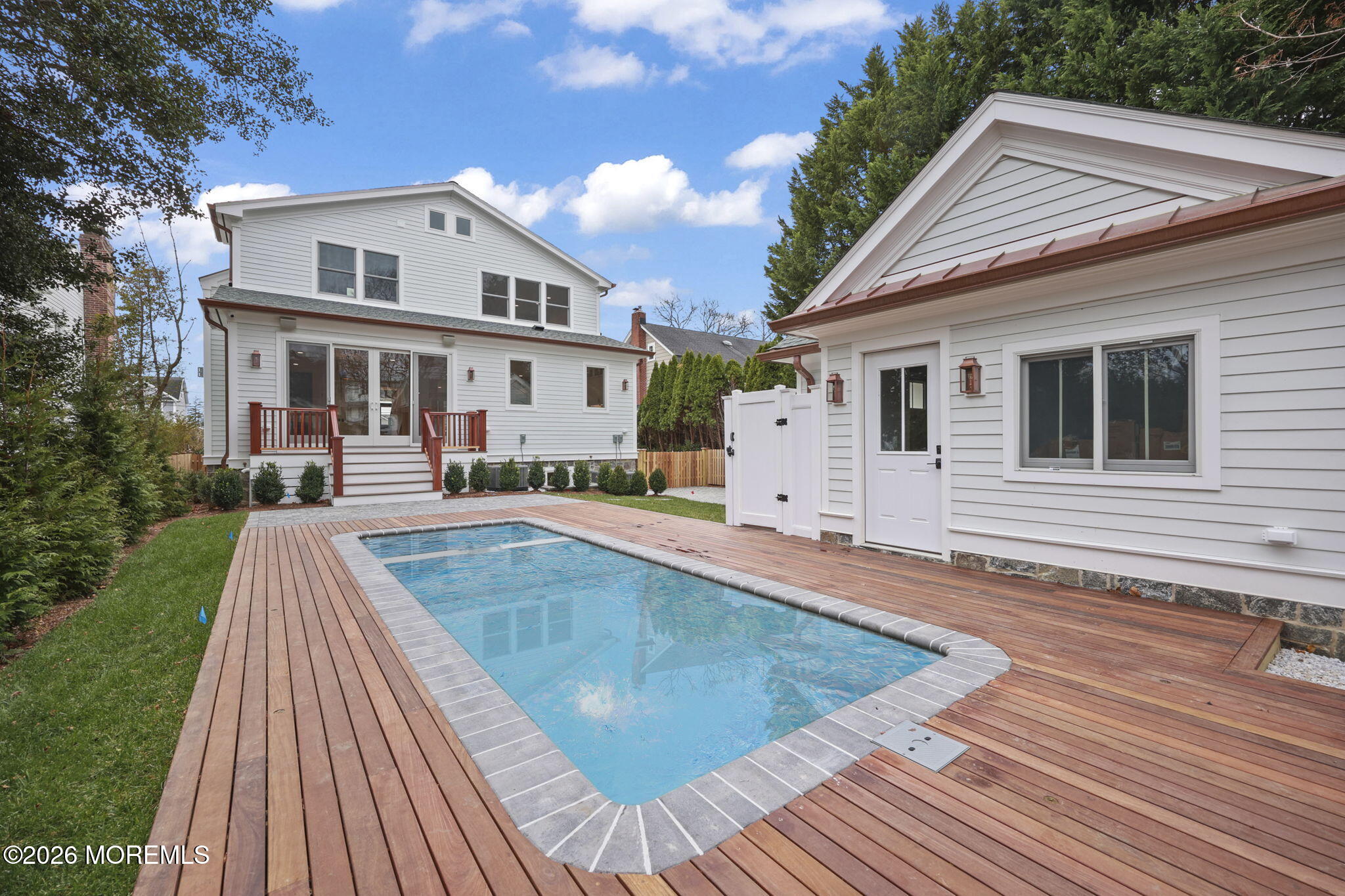 217 Pitney Avenue Spring Lake, NJ 07762 - Photo 4 of 18 a view of a house with pool fire pit next to a yard
