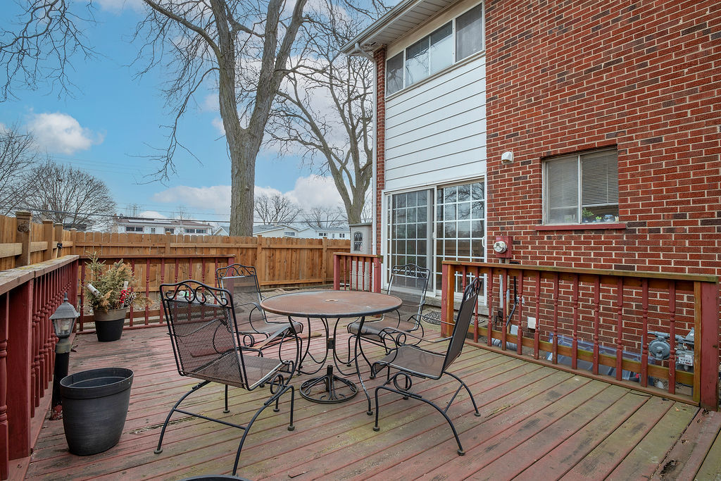 8000 West Lyons Street Niles, IL 60714 - Photo 9 of 14 a view of a chairs and table on the deck