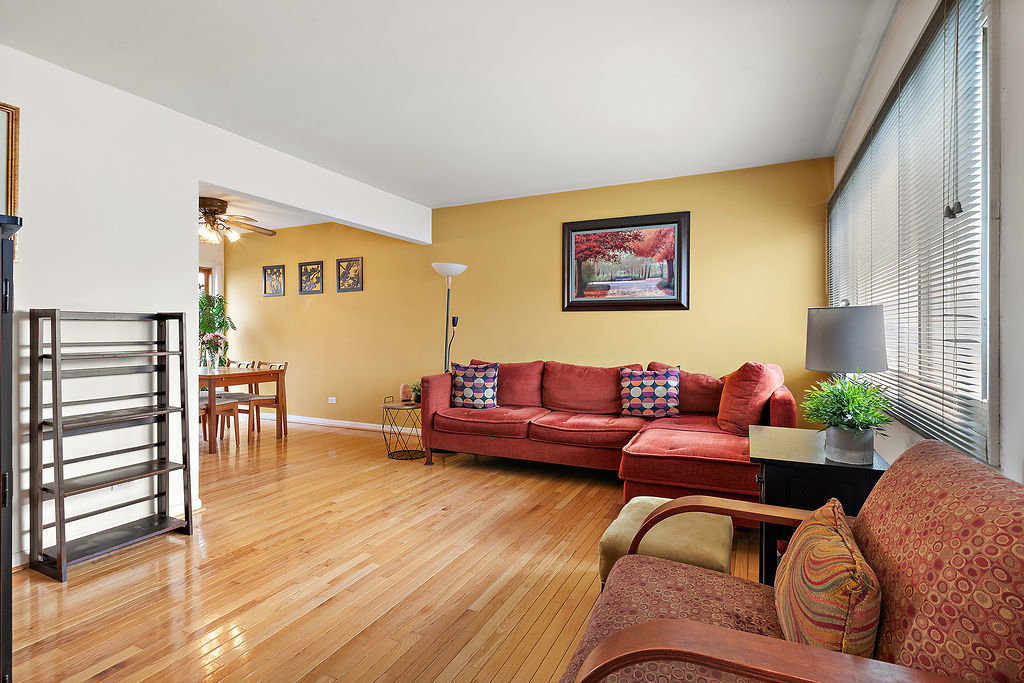 8000 West Lyons Street Niles, IL 60714 - Photo 3 of 14 a living room with furniture and a wooden floor