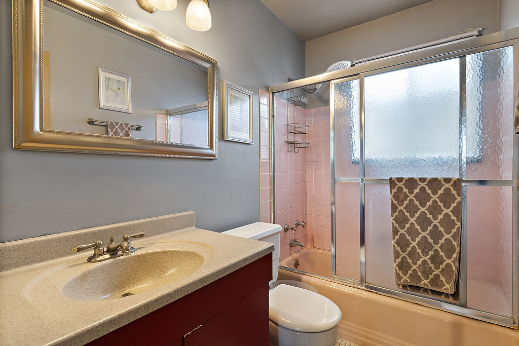 8000 West Lyons Street Niles, IL 60714 - Photo 6 of 14 a bathroom with a granite countertop sink toilet and shower