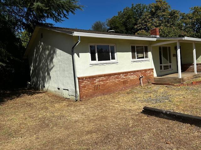 2976 West Way Redding, CA 96002 - Photo 1 of 4 a view of a house with backyard and a tree