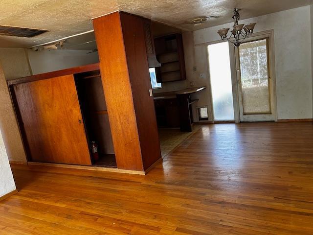 2976 West Way Redding, CA 96002 - Photo 4 of 4 an empty room with wooden floor and windows