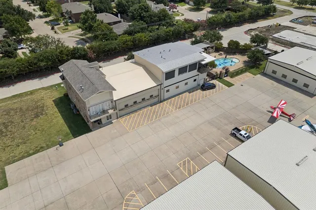 an aerial view of a house with outdoor space