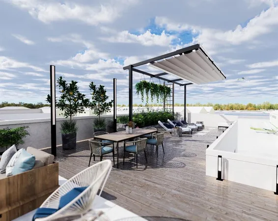 a living room with patio furniture and a garden