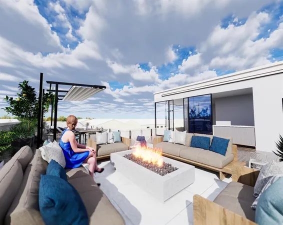 a view of the patio with couches and a potted plant