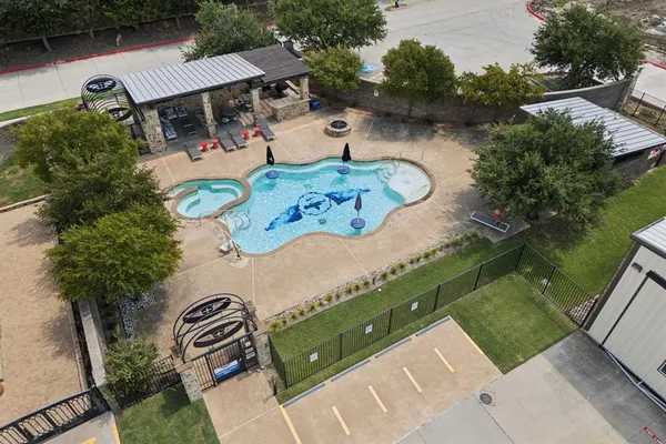 an aerial view of a house with outdoor space