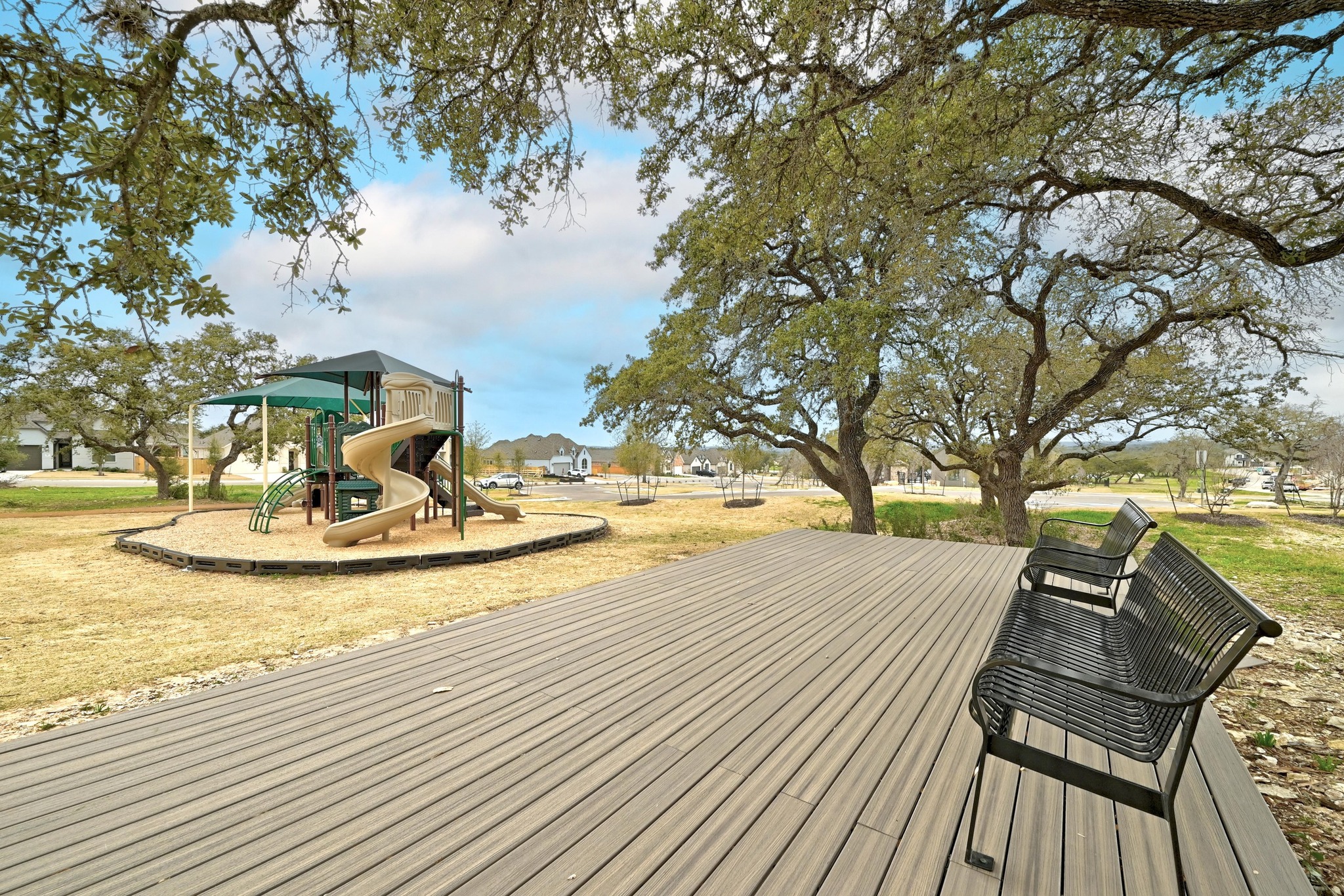 208 West Branch Road Kyle, TX 78640 - Photo 26 of 27 Shaded bench seating give parents a place to catch up while the kids play.