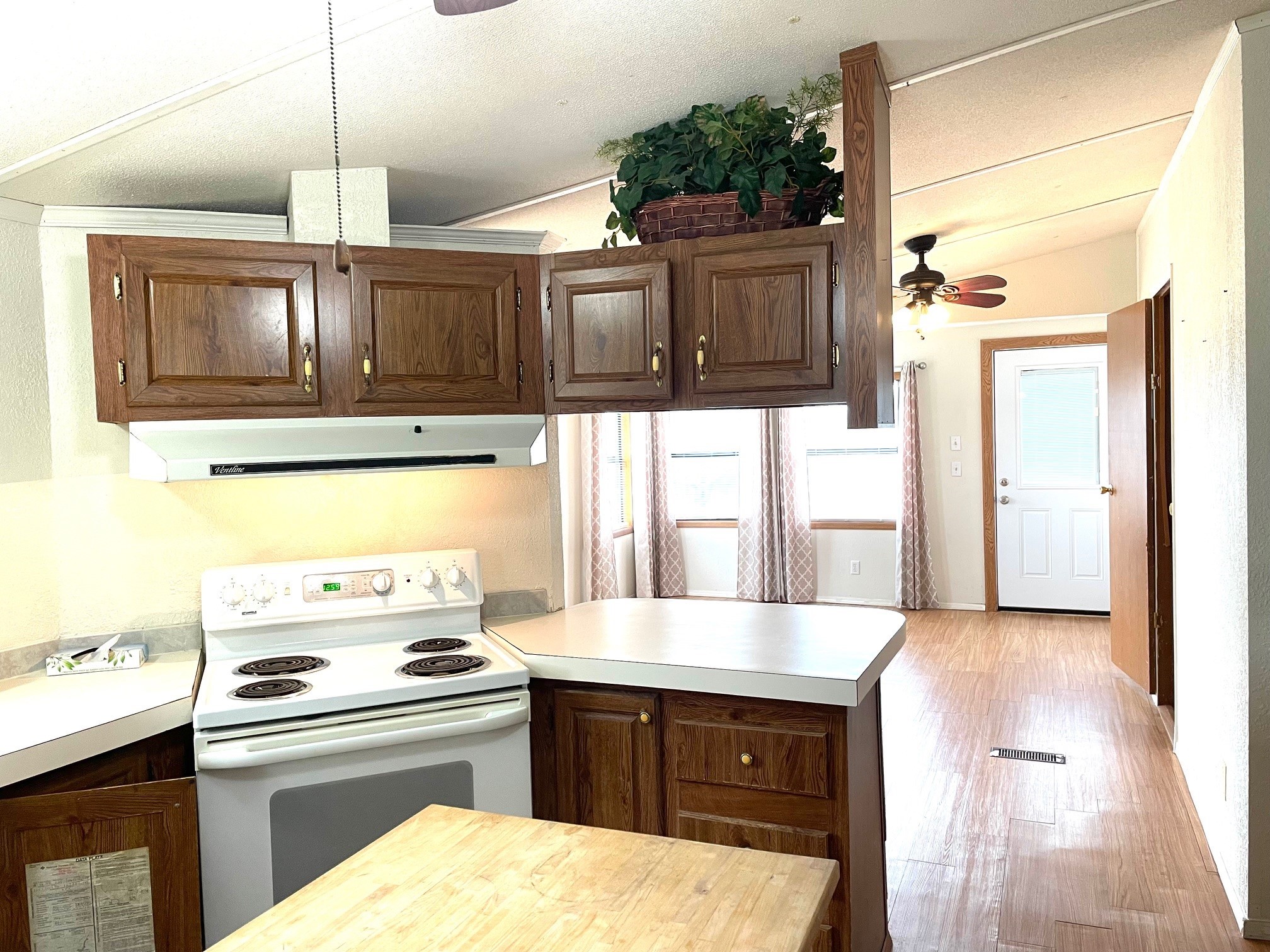 800 Archie Lane Belton, TX 76513 - Photo 17 of 32 Nice electric stove has cabinets above and to the side for your pots and pans.