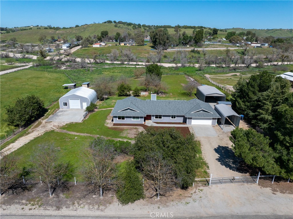 6446 Windmill Place Paso Robles, CA 93446 - Photo 1 of 44 an aerial view of a house with a garden and lake view