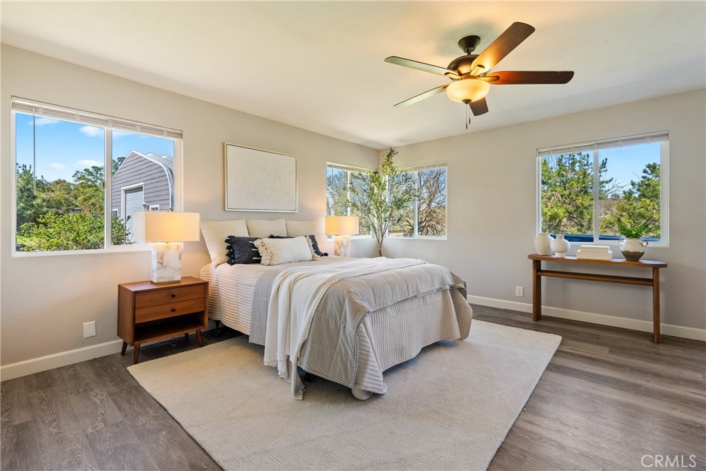 6446 Windmill Place Paso Robles, CA 93446 - Photo 14 of 44 a bedroom with a bed and a chandelier