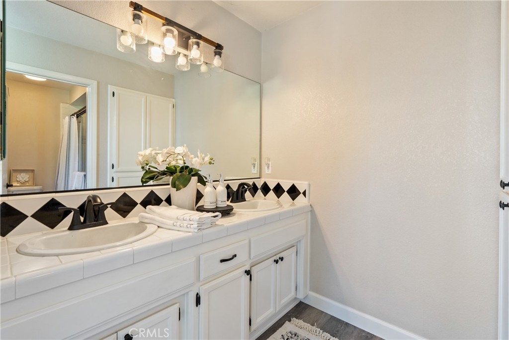 6446 Windmill Place Paso Robles, CA 93446 - Photo 17 of 44 a bathroom with a sink and a mirror