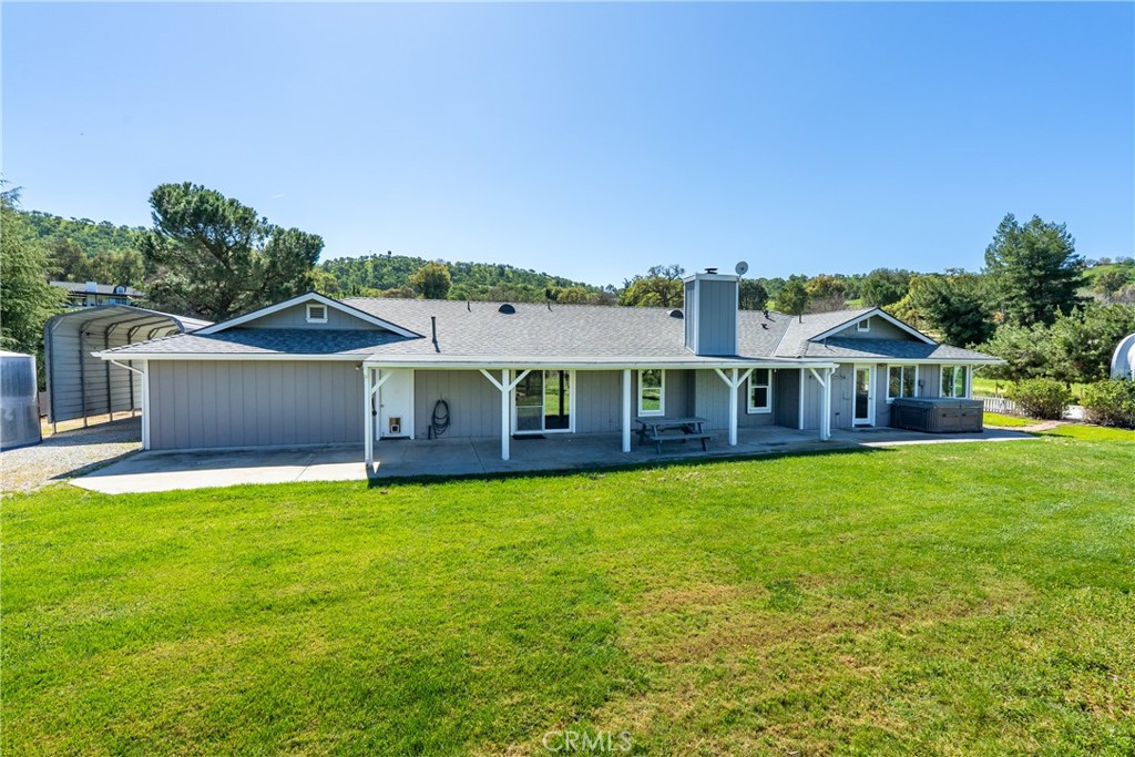 6446 Windmill Place Paso Robles, CA 93446 - Photo 22 of 44 a front view of a house with yard and green space