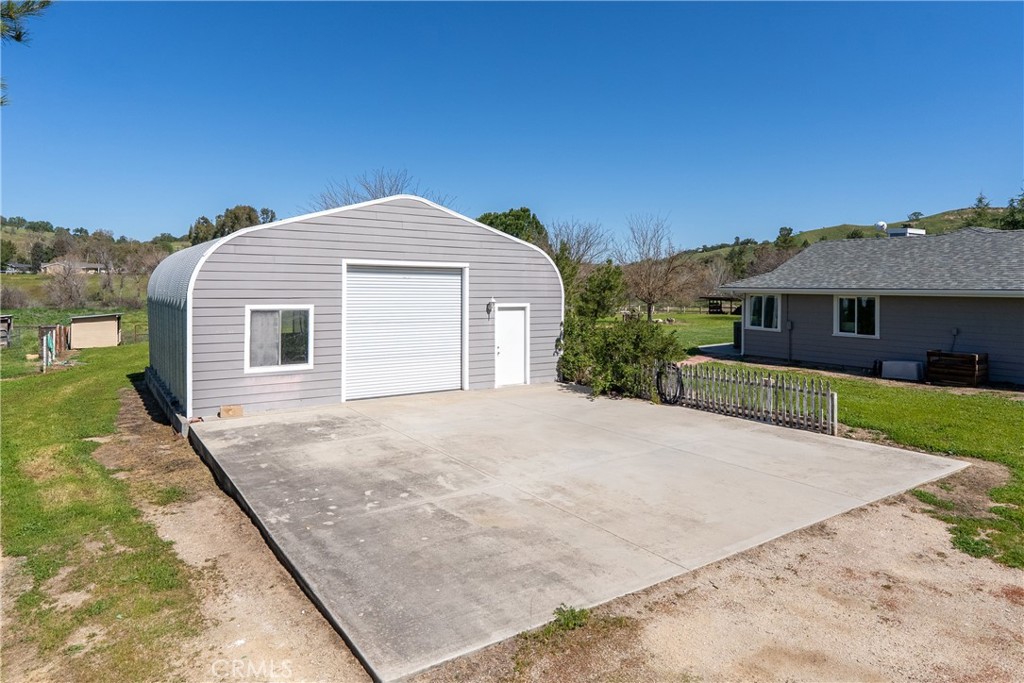 6446 Windmill Place Paso Robles, CA 93446 - Photo 26 of 44 a front view of a house with a garden