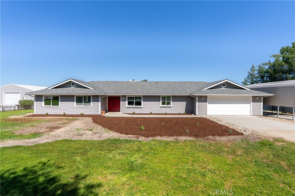 6446 Windmill Place Paso Robles, CA 93446 - Photo 3 of 44 a front view of a house with yard and trees