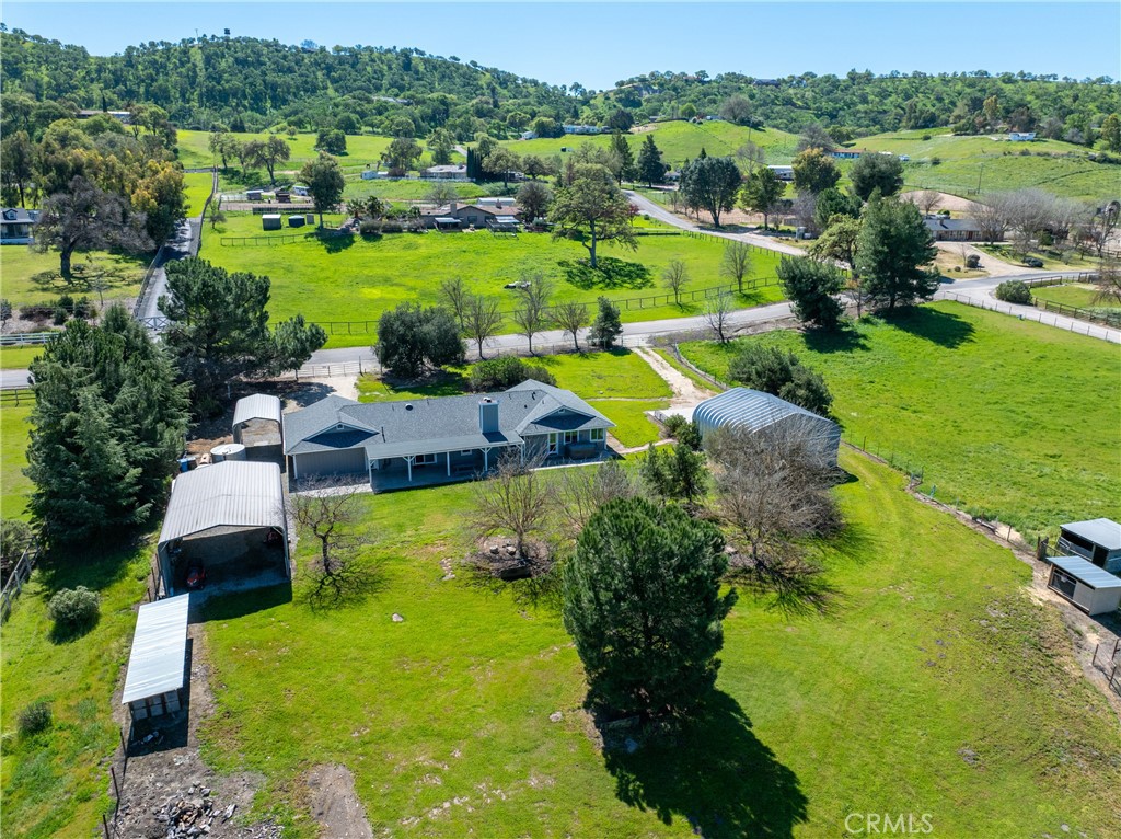 6446 Windmill Place Paso Robles, CA 93446 - Photo 33 of 44 an aerial view of a houses with a garden and lake view
