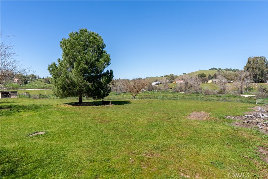6446 Windmill Place Paso Robles, CA 93446 - Photo 38 of 44 a view of a garden with a building in the background