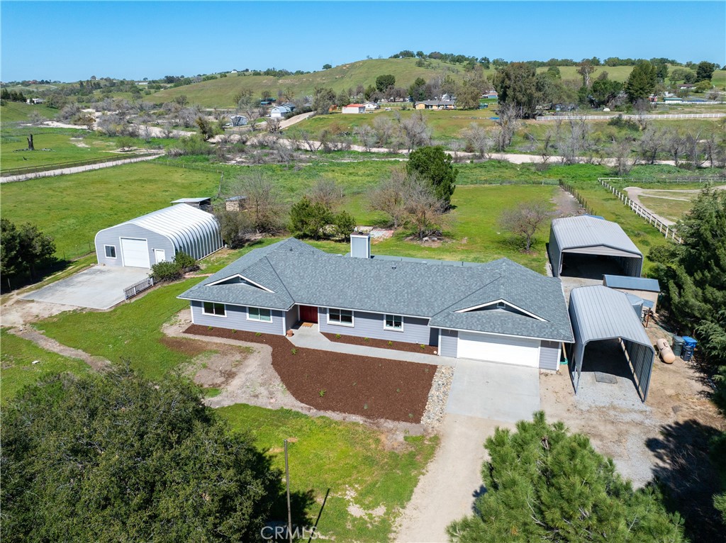 6446 Windmill Place Paso Robles, CA 93446 - Photo 42 of 44 an aerial view of a house with garden space and mountain view in back