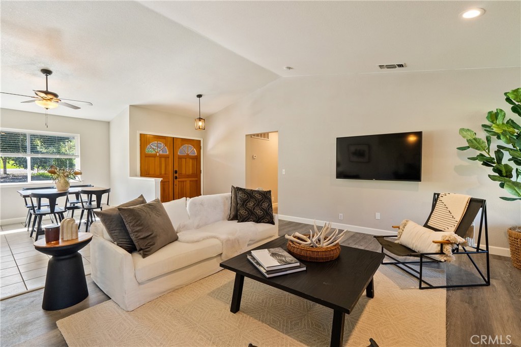 6446 Windmill Place Paso Robles, CA 93446 - Photo 7 of 44 a living room with furniture and a flat screen tv
