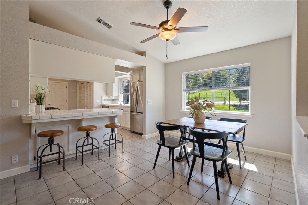 6446 Windmill Place Paso Robles, CA 93446 - Photo 8 of 44 a view of a dining room with furniture and a window