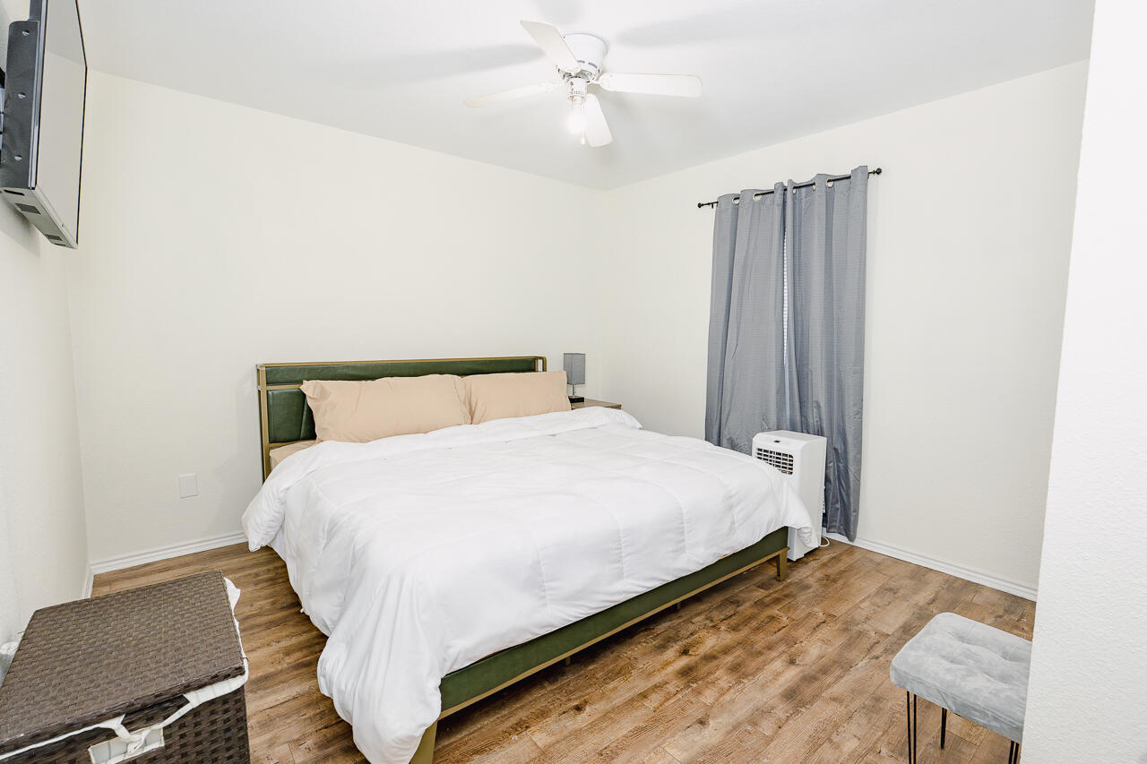 1016 Ironton Avenue Lubbock, TX 79416 - Photo 14 of 29 a large bed sitting in a bedroom next to a window