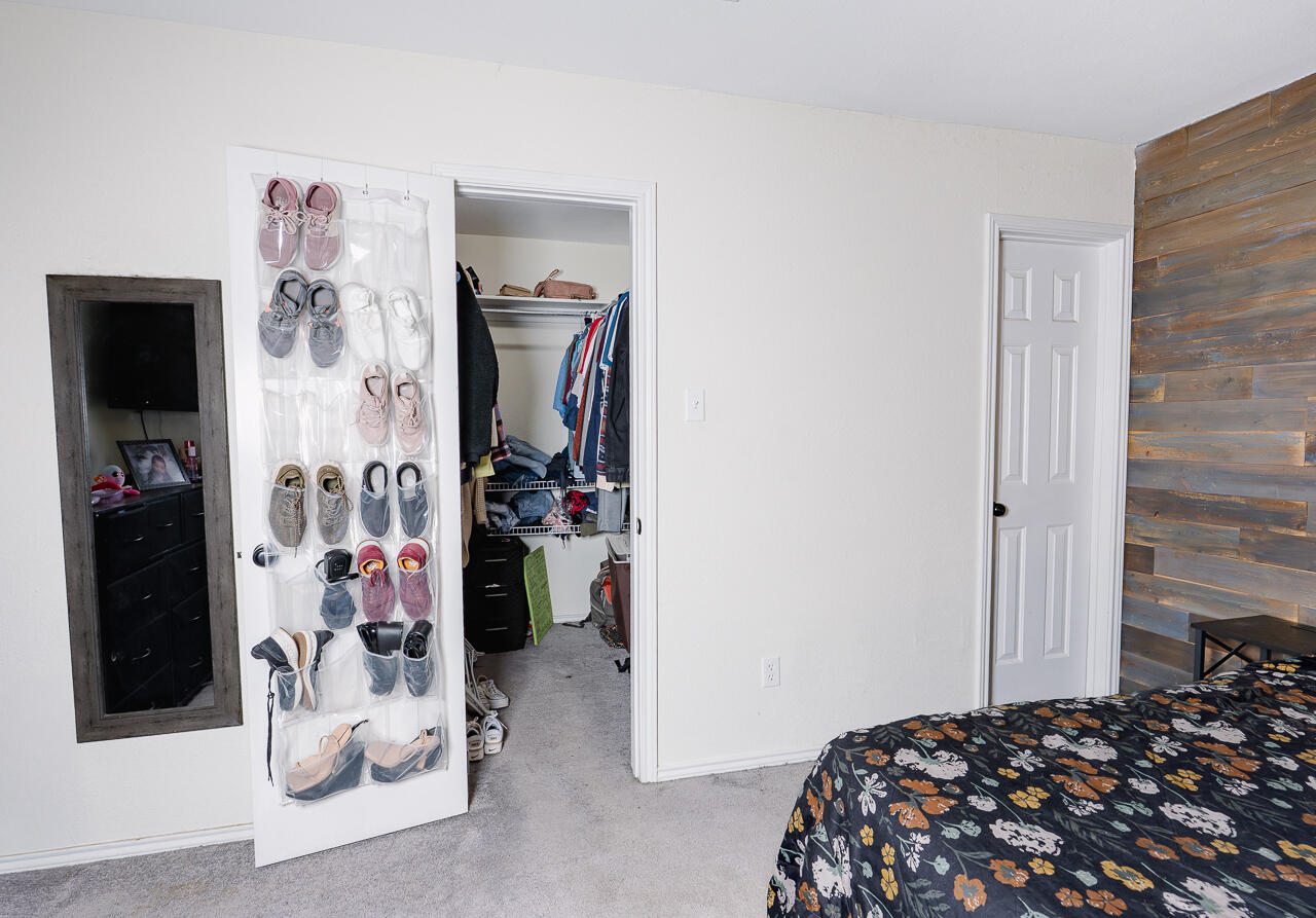 1016 Ironton Avenue Lubbock, TX 79416 - Photo 17 of 29 a bedroom with a bed and a closet