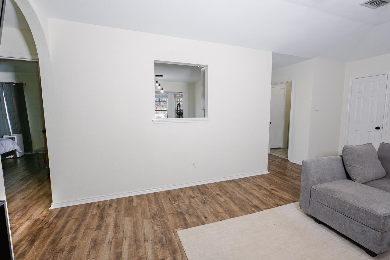 1016 Ironton Avenue Lubbock, TX 79416 - Photo 19 of 29 a view of livingroom with furniture and wooden floor