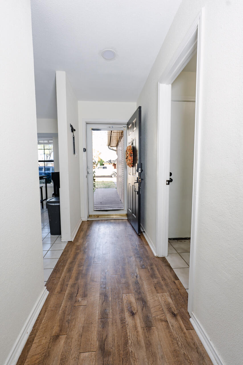 1016 Ironton Avenue Lubbock, TX 79416 - Photo 20 of 29 a view of empty room with kitchen and window
