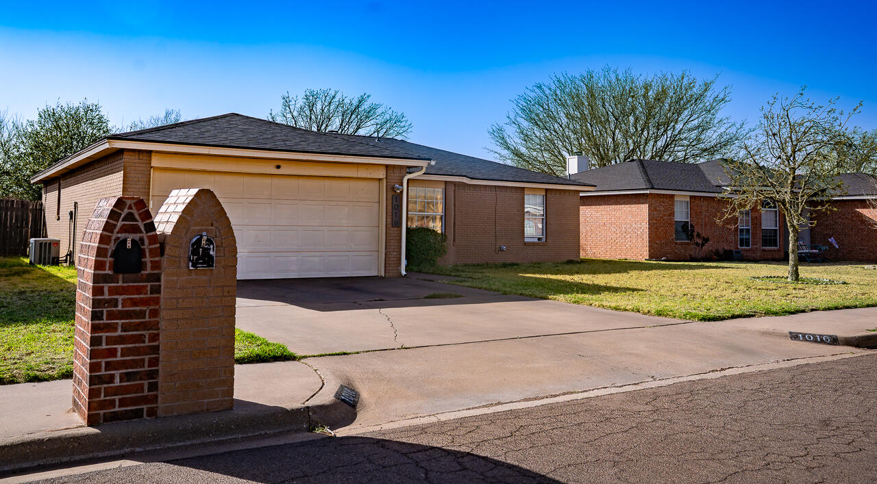 1016 Ironton Avenue Lubbock, TX 79416 - Photo 2 of 29 a front view of a house with a garden and entryway