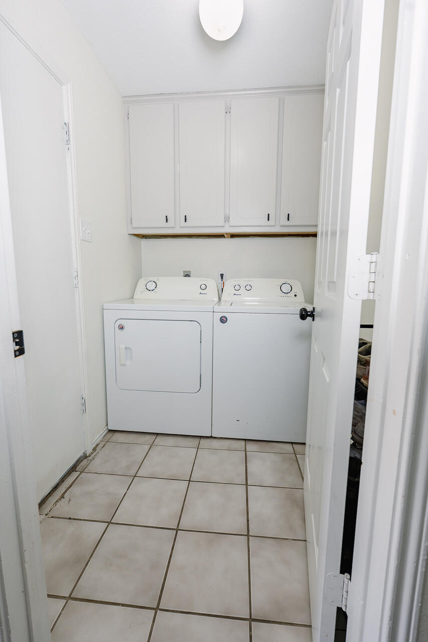 1016 Ironton Avenue Lubbock, TX 79416 - Photo 21 of 29 a view of a utility room with cabinets