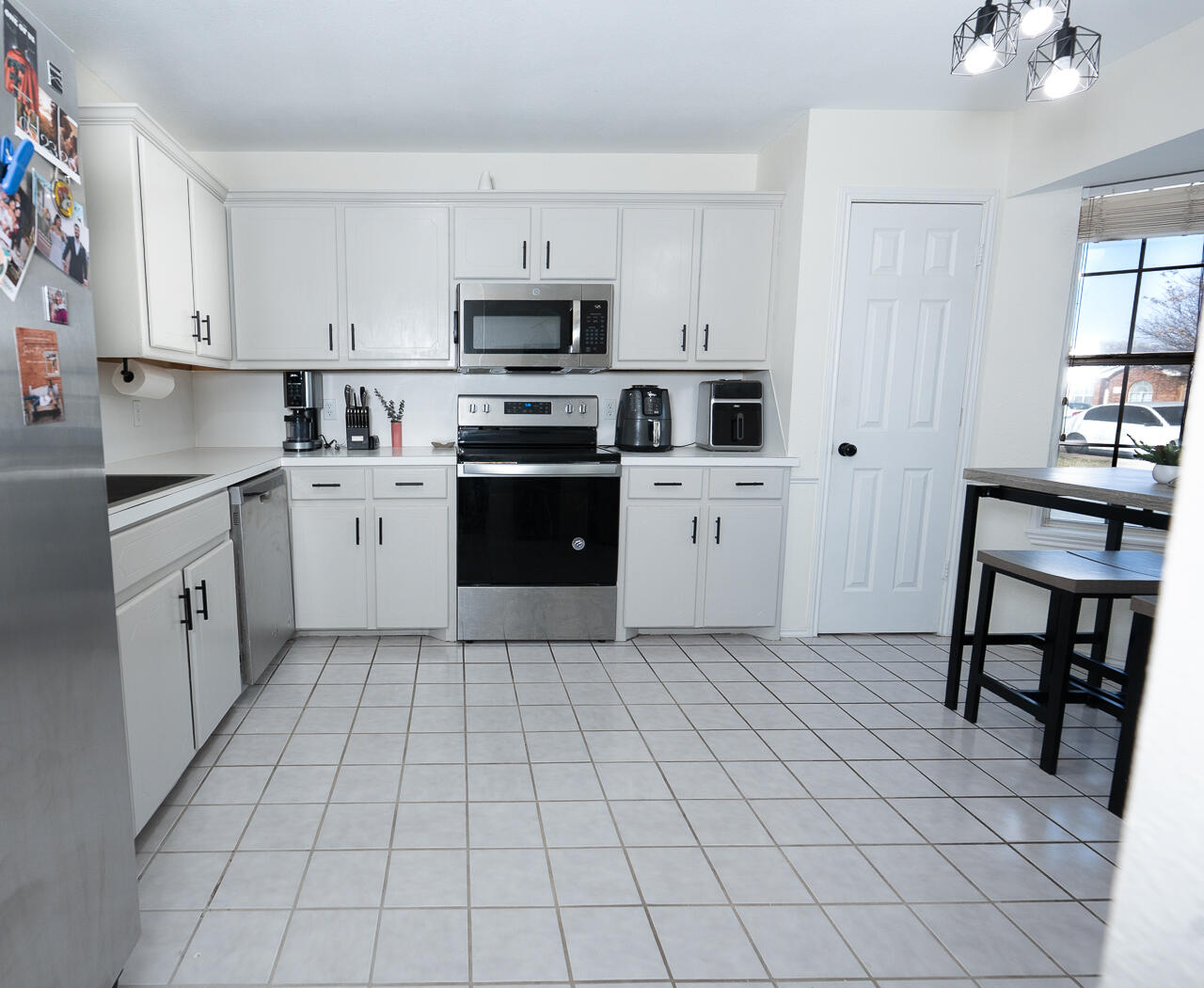 1016 Ironton Avenue Lubbock, TX 79416 - Photo 22 of 29 a kitchen with cabinets and steel appliances