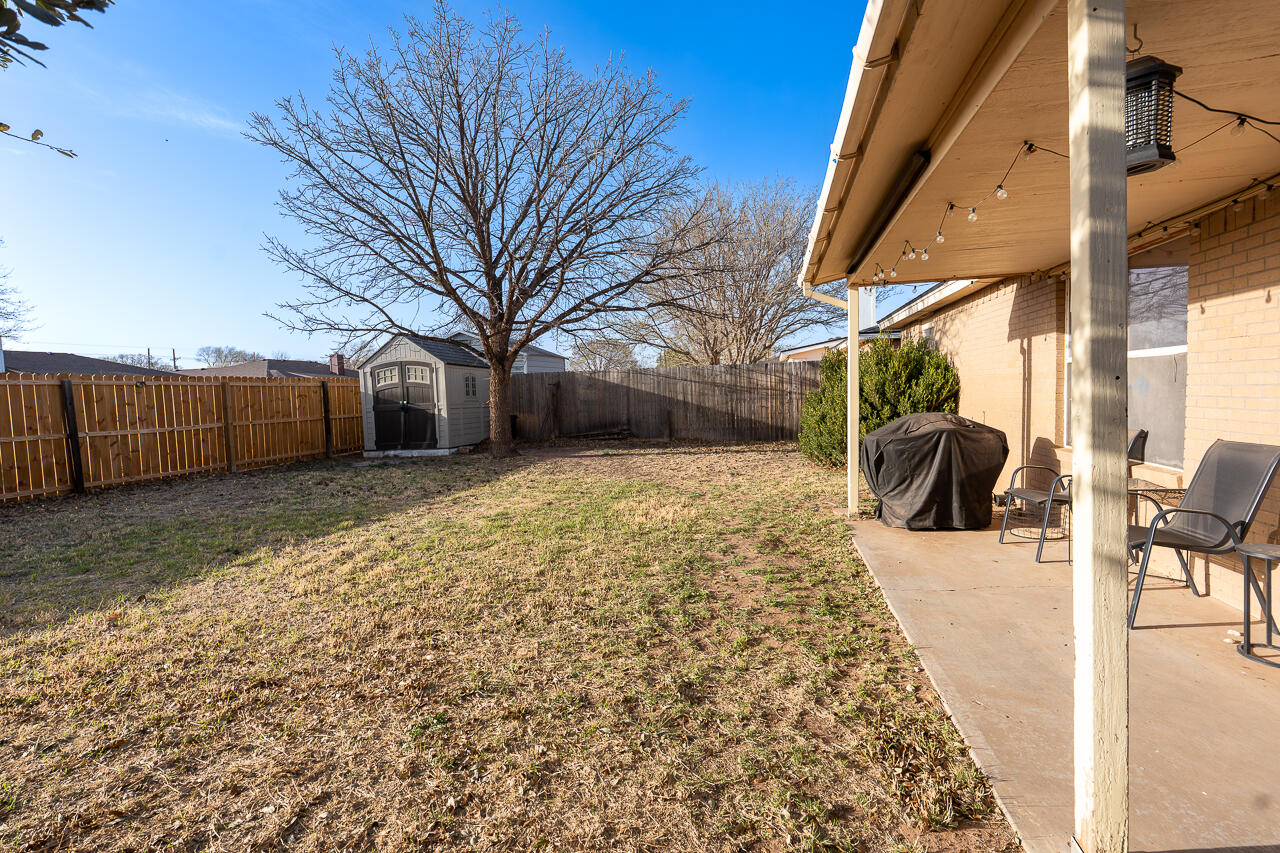 1016 Ironton Avenue Lubbock, TX 79416 - Photo 28 of 29 a view of a backyard with a large tree