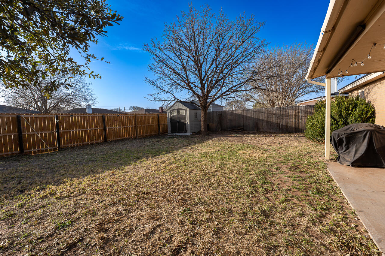 1016 Ironton Avenue Lubbock, TX 79416 - Photo 29 of 29 a view of a yard with a large tree