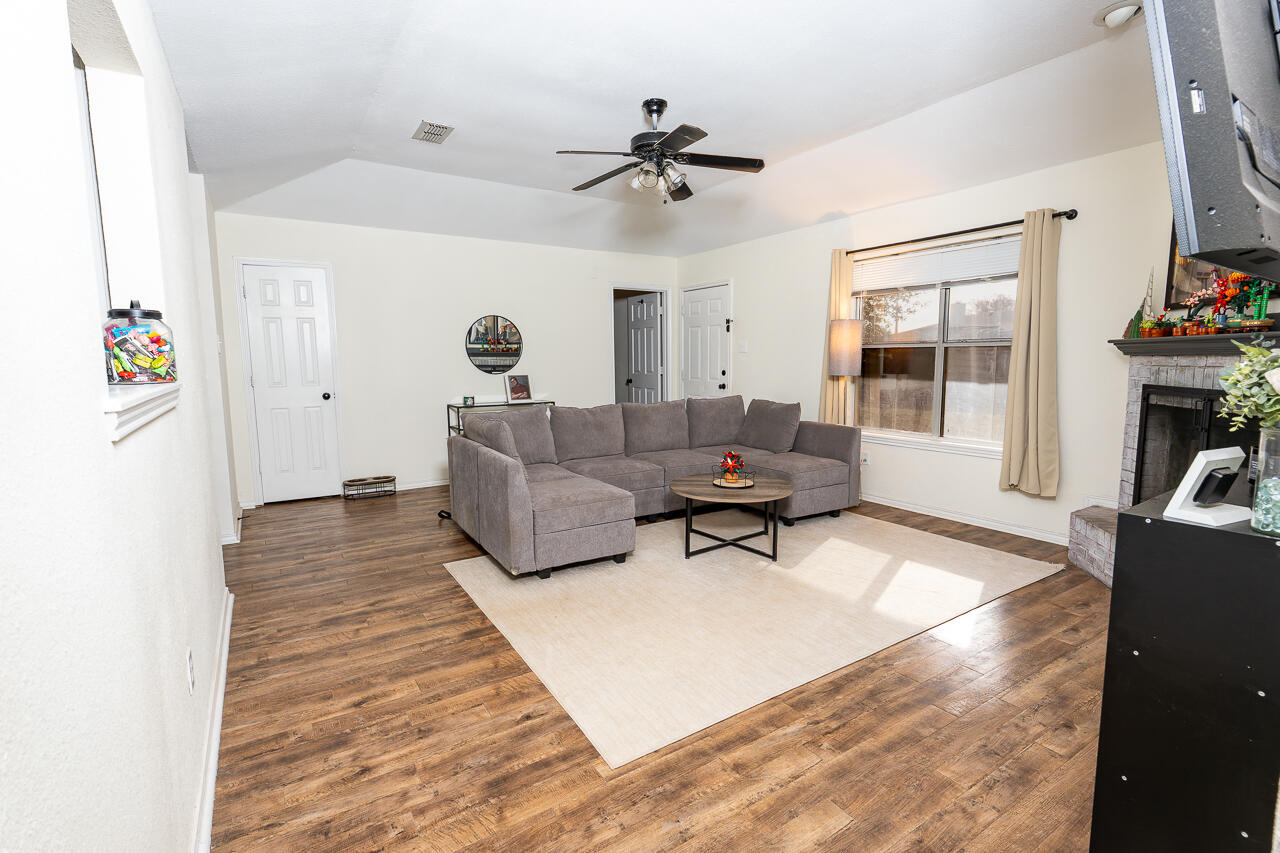1016 Ironton Avenue Lubbock, TX 79416 - Photo 6 of 29 a living room with furniture and a window