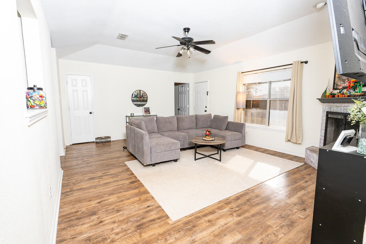 1016 Ironton Avenue Lubbock, TX 79416 - Photo 7 of 29 a living room with furniture and a window