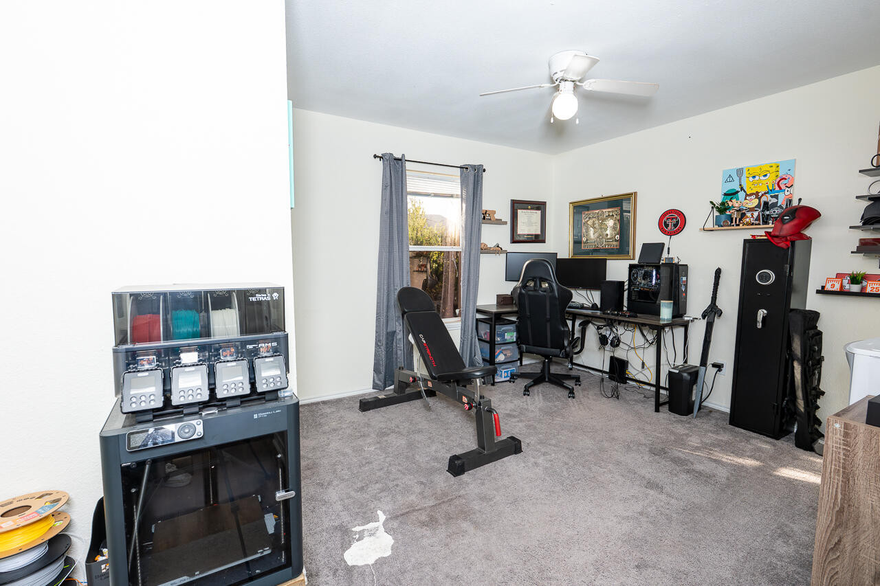 1016 Ironton Avenue Lubbock, TX 79416 - Photo 8 of 29 a view of a livingroom with furniture and a flat screen tv