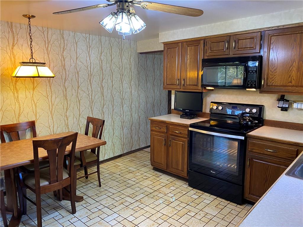 7919 Mt Carmel Road Verona, PA 15147 - Photo 12 of 38 a kitchen with a stove and a microwave