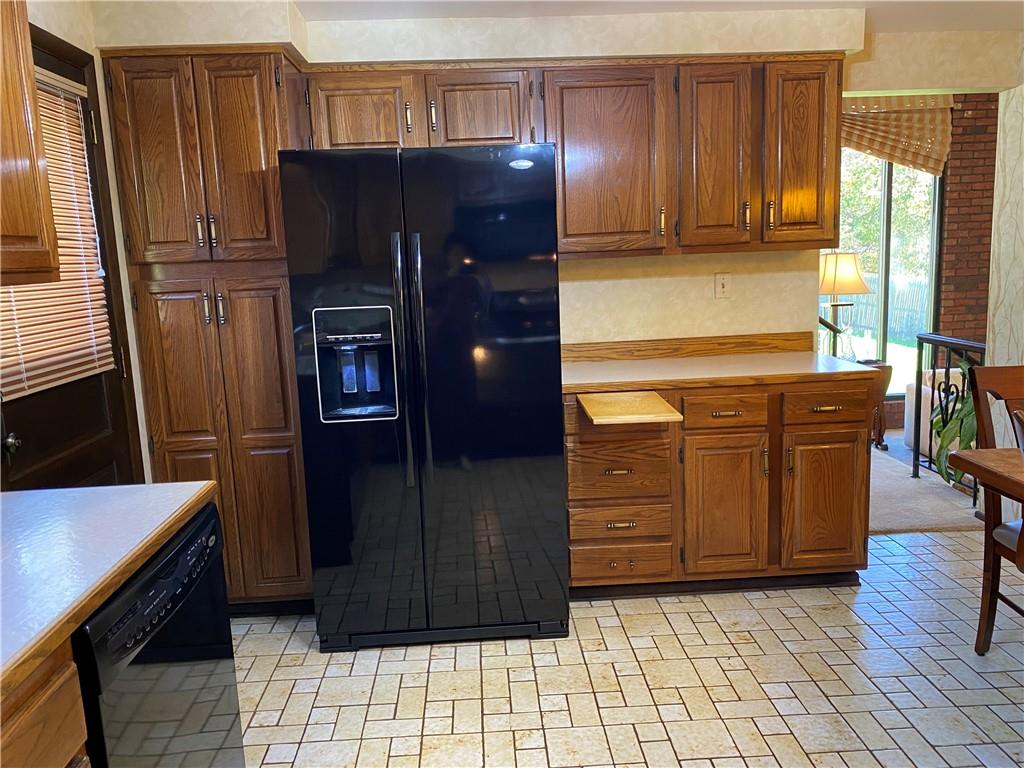 7919 Mt Carmel Road Verona, PA 15147 - Photo 13 of 38 a kitchen with stainless steel appliances granite countertop a refrigerator and a stove