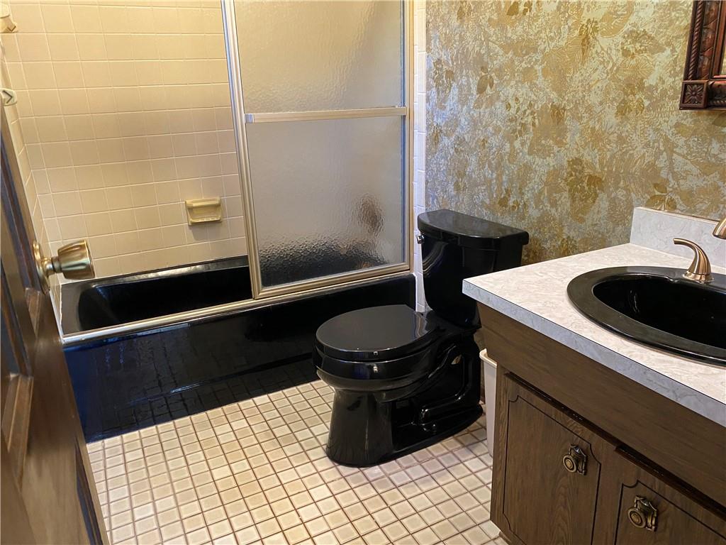7919 Mt Carmel Road Verona, PA 15147 - Photo 21 of 38 a bathroom with a sink and a toilet