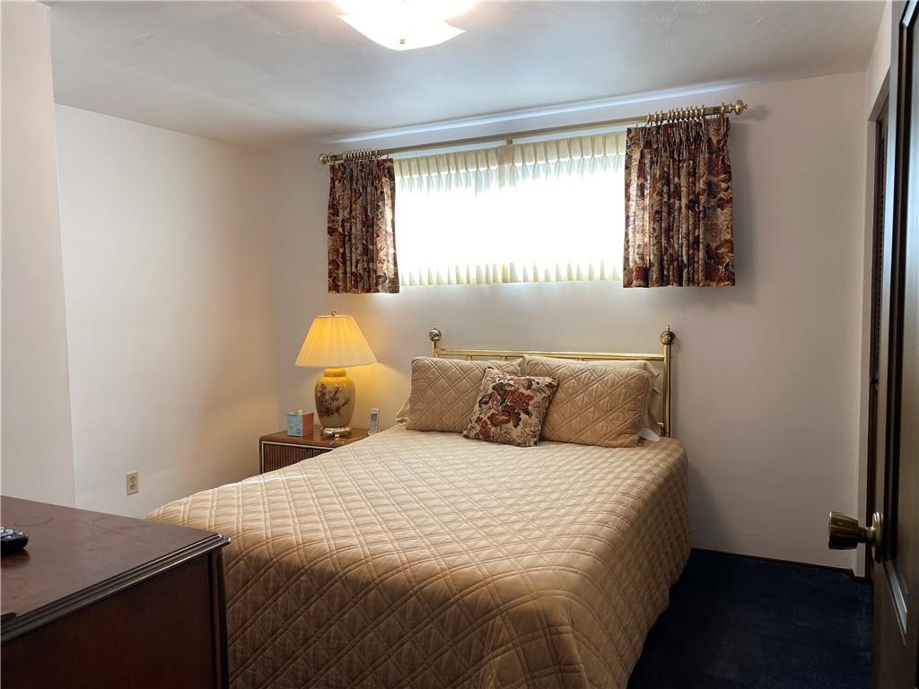 7919 Mt Carmel Road Verona, PA 15147 - Photo 23 of 38 a bedroom with a bed and a window