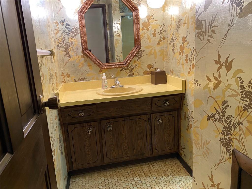 7919 Mt Carmel Road Verona, PA 15147 - Photo 24 of 38 a bathroom with a sink and a mirror