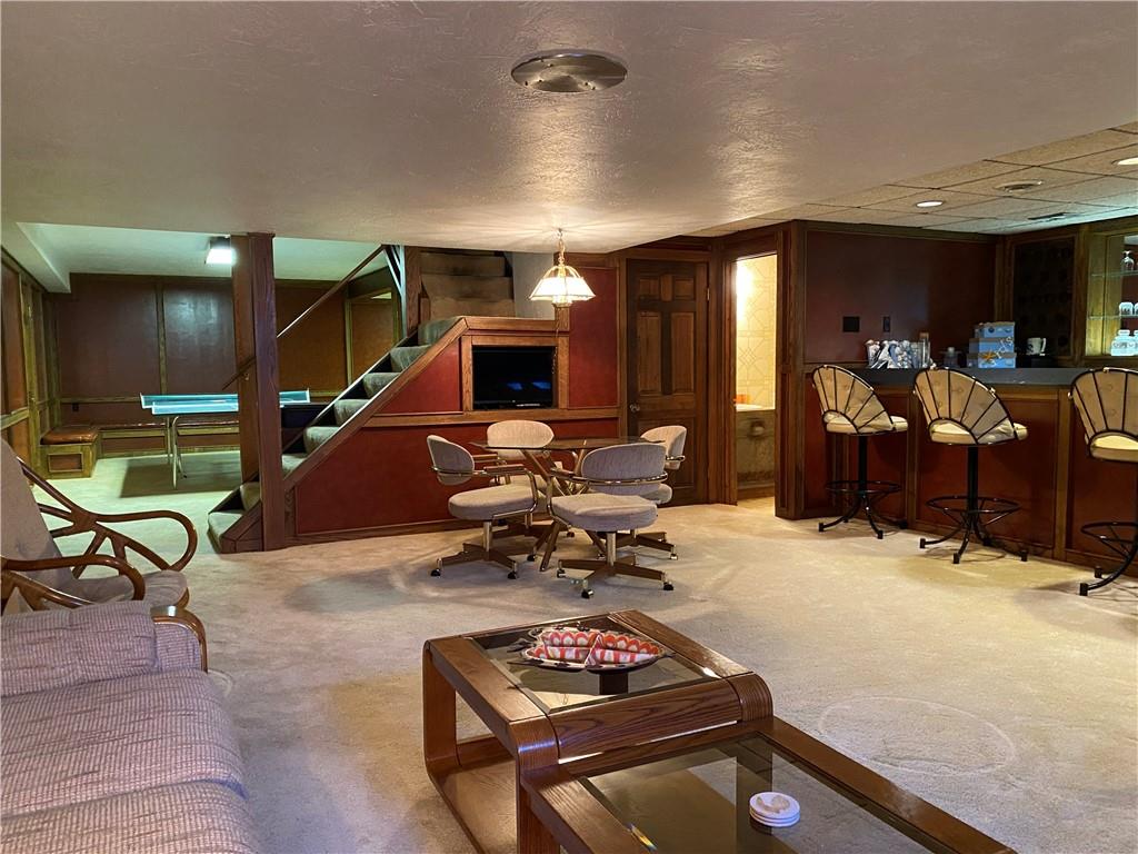 7919 Mt Carmel Road Verona, PA 15147 - Photo 28 of 38 a living room with furniture gym equipment and a view of living room