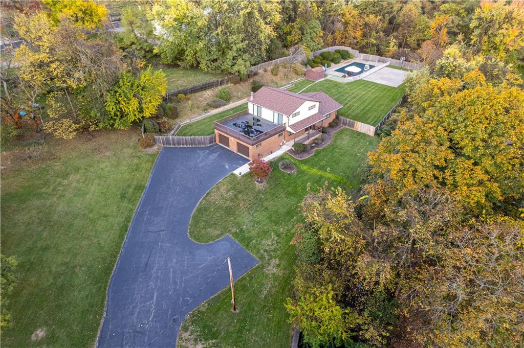 7919 Mt Carmel Road Verona, PA 15147 - Photo 3 of 38 a view of a backyard with plants and outdoor seating